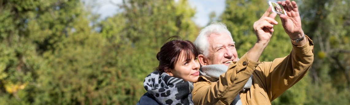 grandfather and granddaughter taking selfie